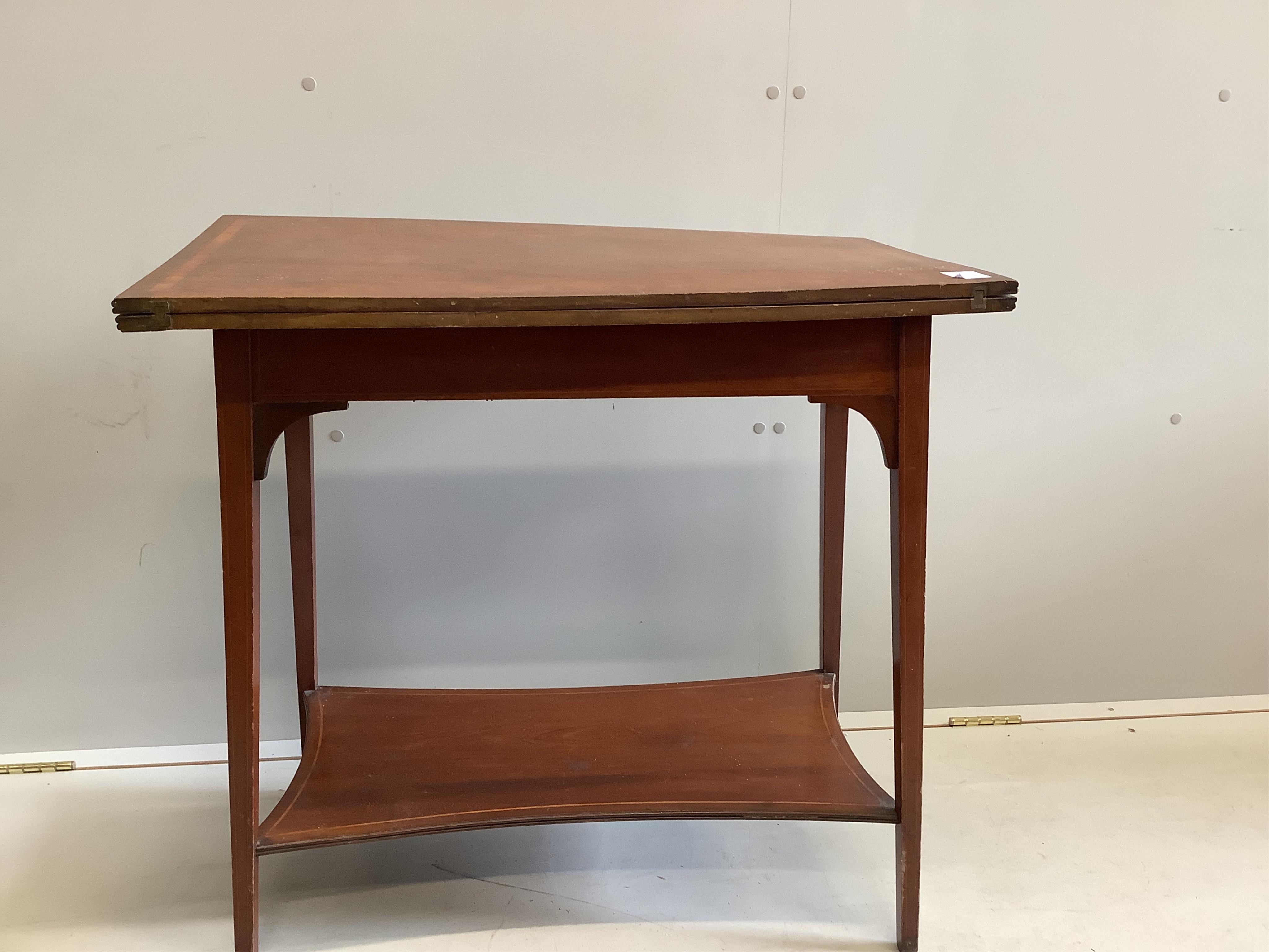 An Edwardian satinwood banded mahogany rectangular folding tea table, width 75cm, depth 42cm, height 73cm. Condition - fair